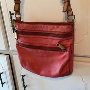 Fossil crossbody leather bag it has some warn spots front and around the edges